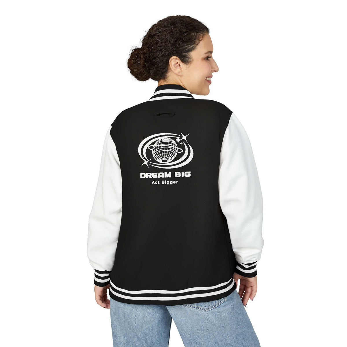 Woman wearing black and white Dream Big jacket with inspirational globe design on back