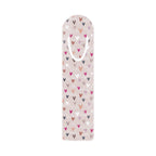 Colorful aluminum bookmark with heart patterns and top slot for holding pages