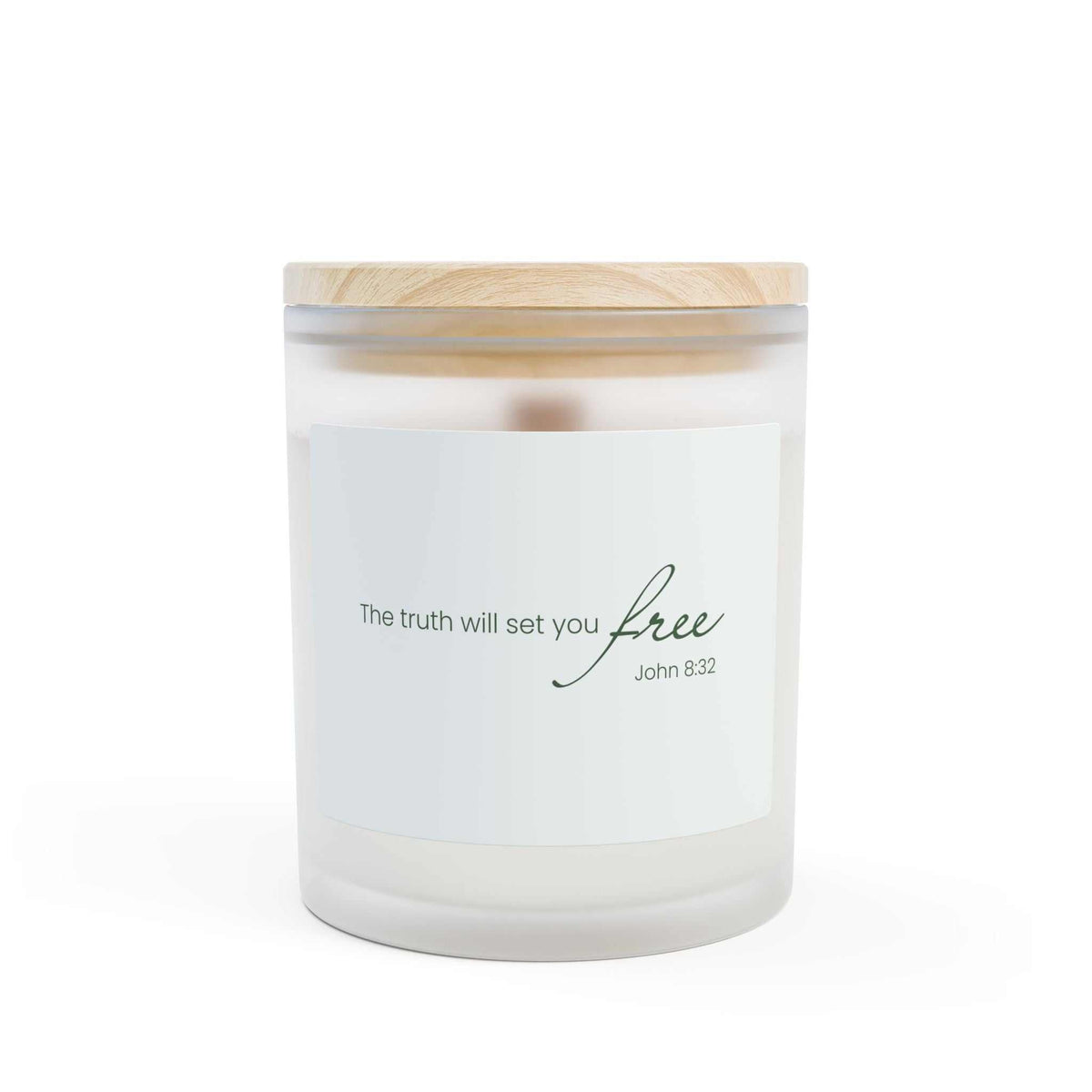 Frosted glass candle with wooden lid featuring inspirational quote, natural off-white coconut soy wax, and wooden wick for calming light and reflection