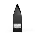 Black medium-dark roast coffee bag with nutrition facts label