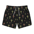 Black swim trunks with watercolor-style green and brown cross patterns