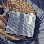 Christian bookmark with top slot holding a page in an open book
