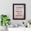 Motivational Dream to Reality poster with inspirational quote in modern black frame on wall above desk with plants and decor