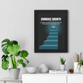 Embrace Growth motivational poster with staircase design in black frame on wall above white shelf with plants and books