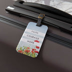 Faith Courage Hope luggage tag with floral design and adjustable leather strap on suitcase handle