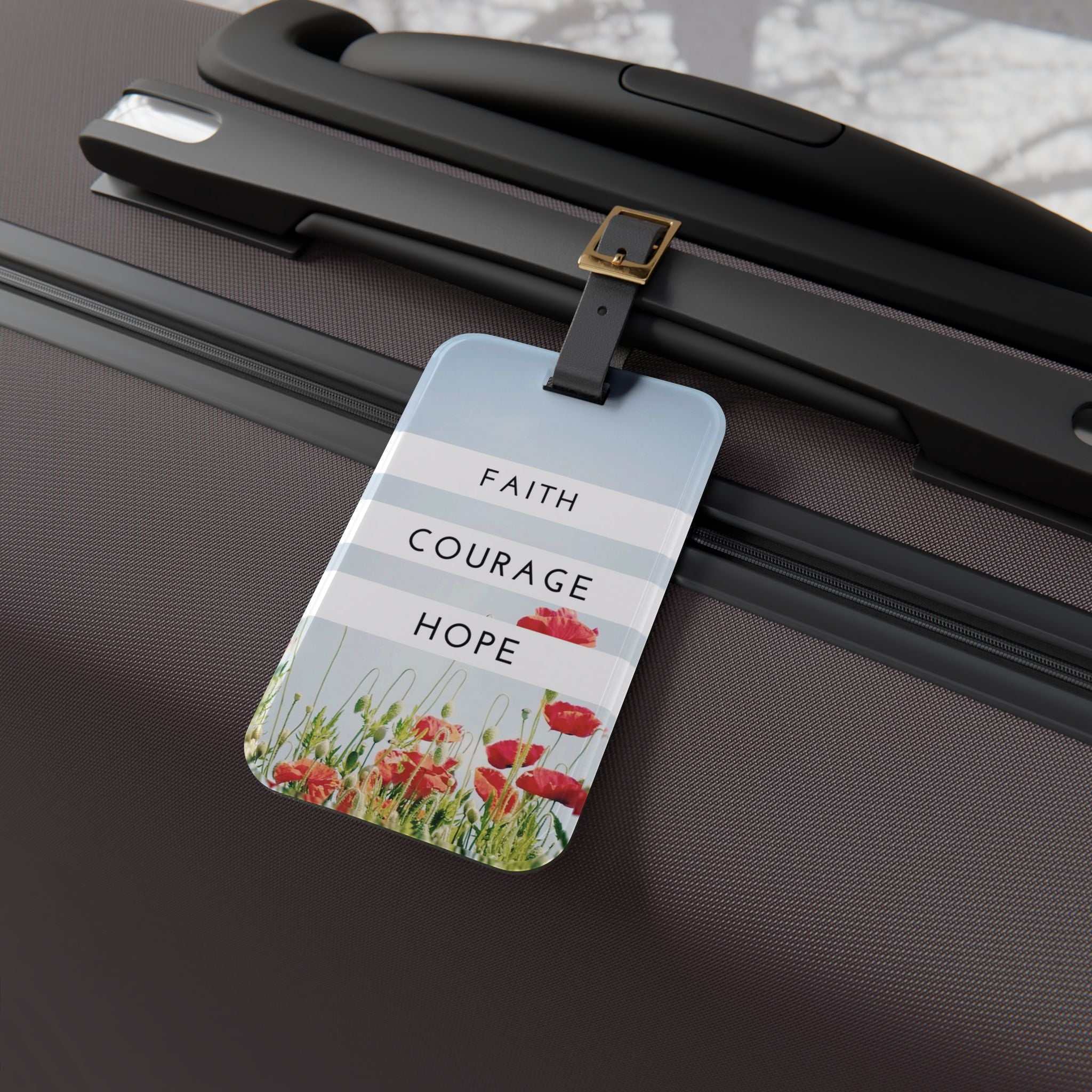 Faith Courage Hope luggage tag with floral design and adjustable leather strap on suitcase handle