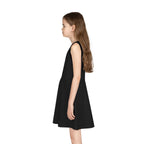 Girl wearing black A-line sleeveless sundress in side view