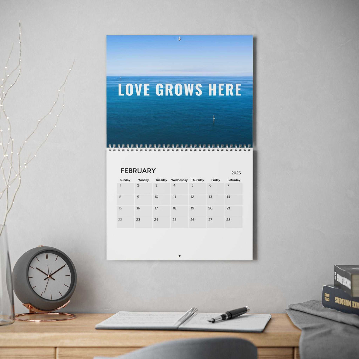 Good Vibes Calendar 2026 with colorful motivational quotes and silver wire binding