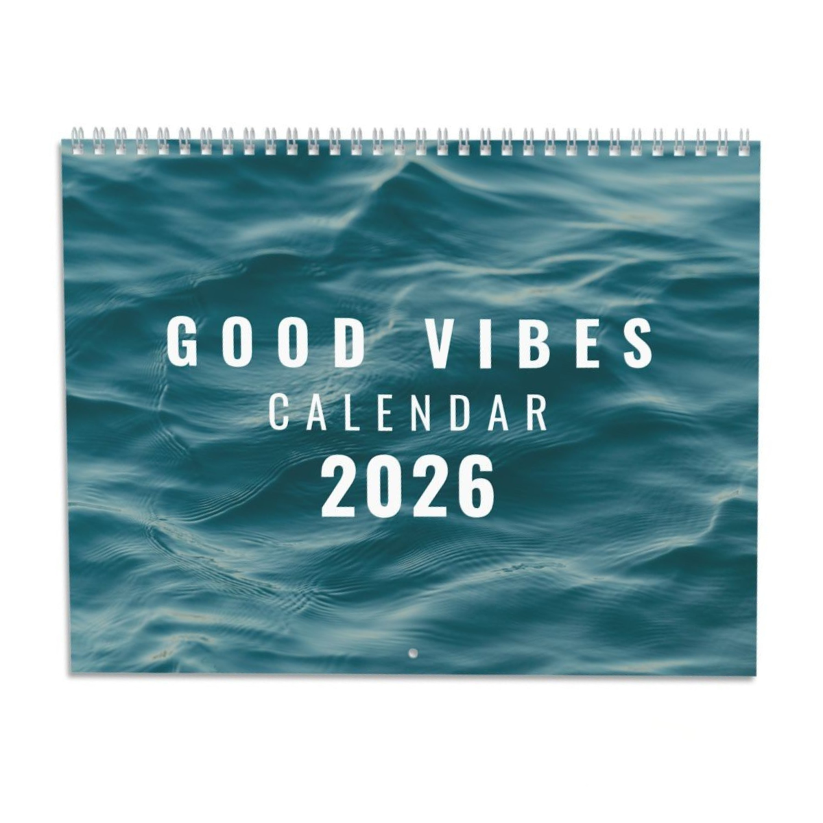 2026 Good Vibes Calendar with colorful motivational quotes and silver wire binding