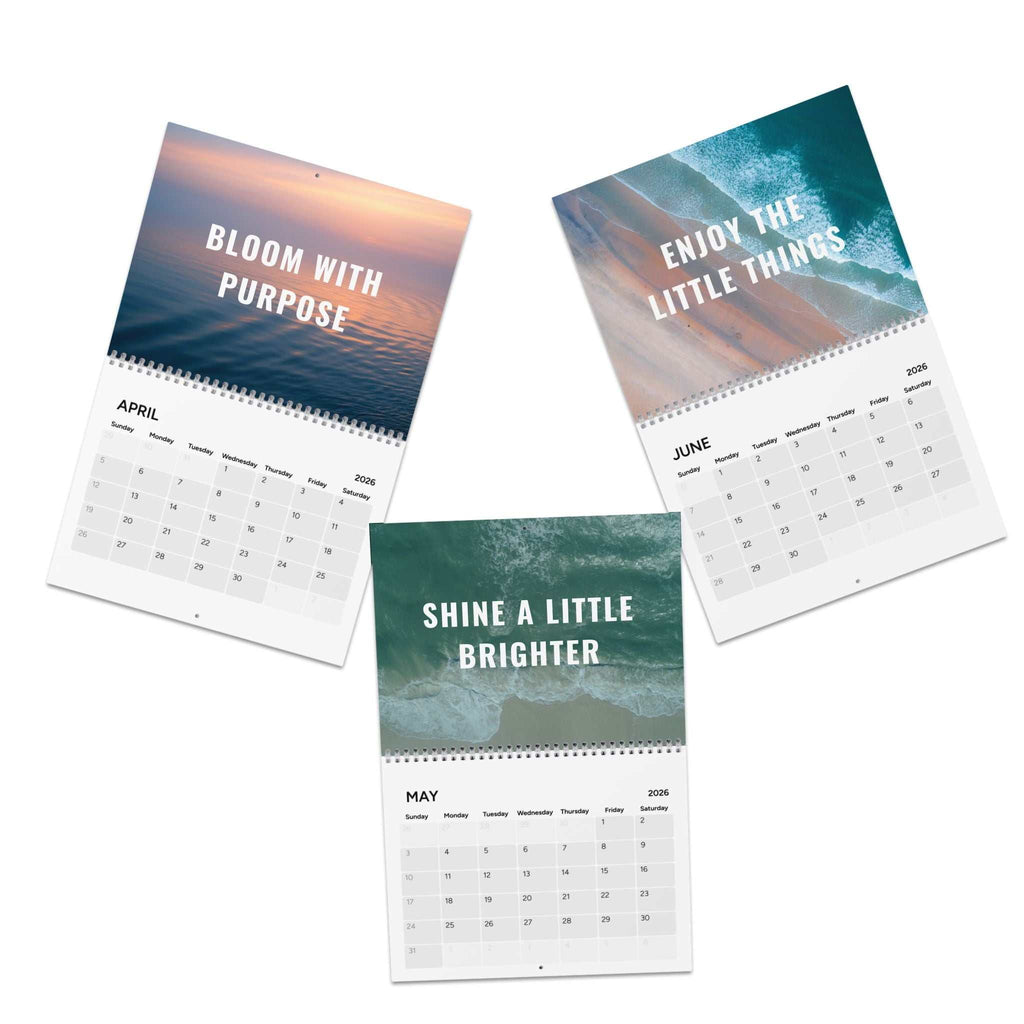 2026 Good Vibes Calendar with colorful motivational quotes and silver wire binding on semi-glossy paper