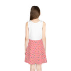Back view of a sleeveless sundress with a white top and pink A-line skirt featuring colorful heart patterns