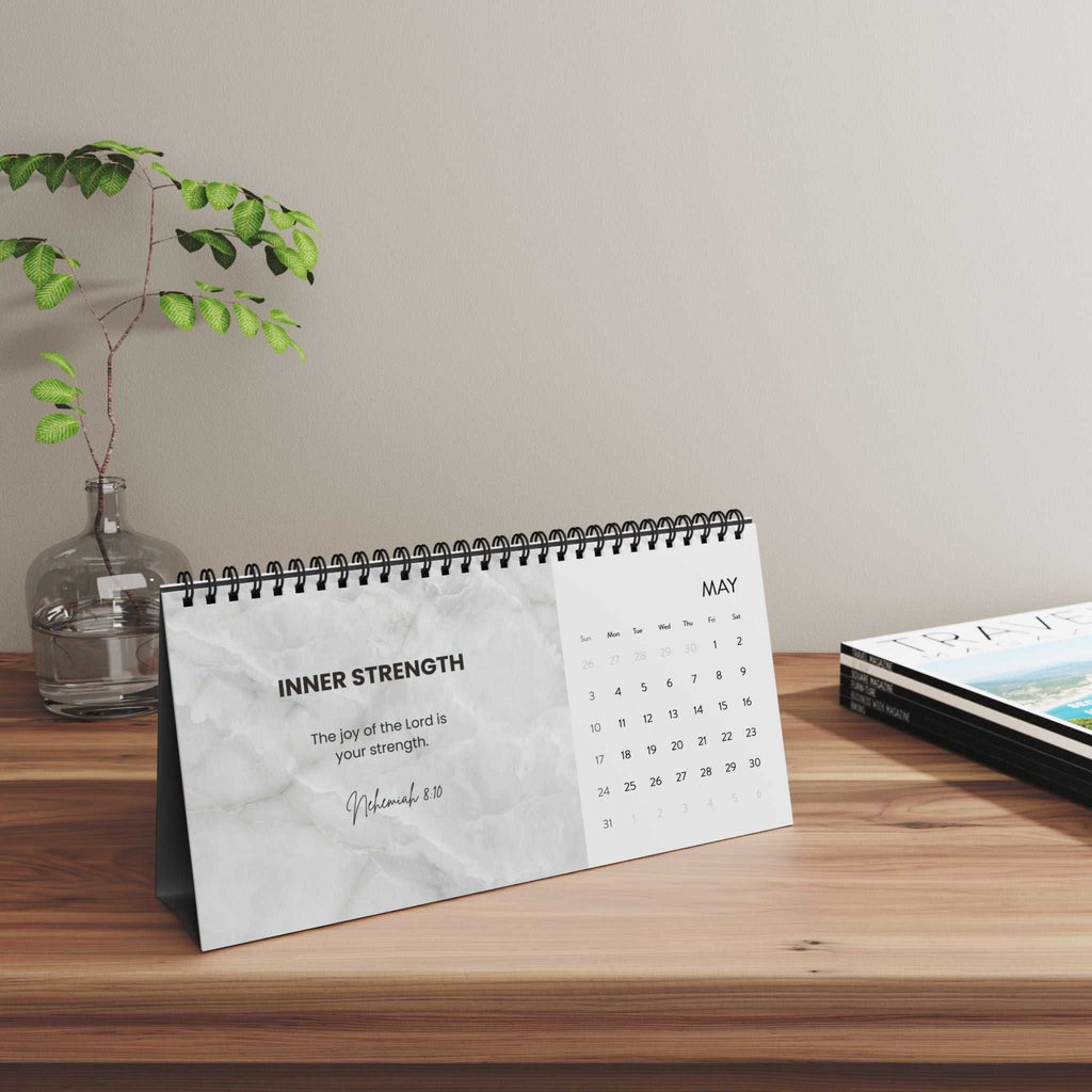 Grace Daily Calendar 2026 with black spiral binding and month grid on matte paper
