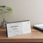 Grace Daily Calendar 2026 with black spiral binding and month grid on matte paper