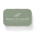 Green bento lunch box with "Believe in yourself" text