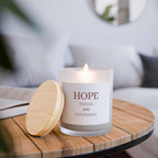 Hope glass candle with coconut soy wax, wooden wick, frosted glass vessel, and raw maple lid on wooden table