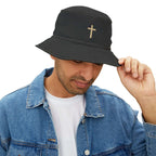Man wearing black Faith Bucket Hat with gold cross symbol