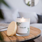 New Beginnings glass candle with coconut soy wax, wooden wick, frosted vessel, and maple lid burning on wooden tray