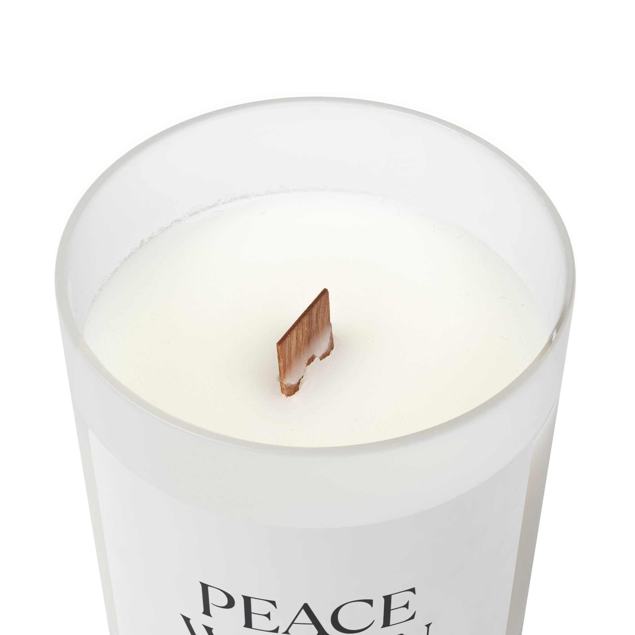off-white coconut soy wax candle in frosted glass with wooden wick and glossy label for peaceful ambiance