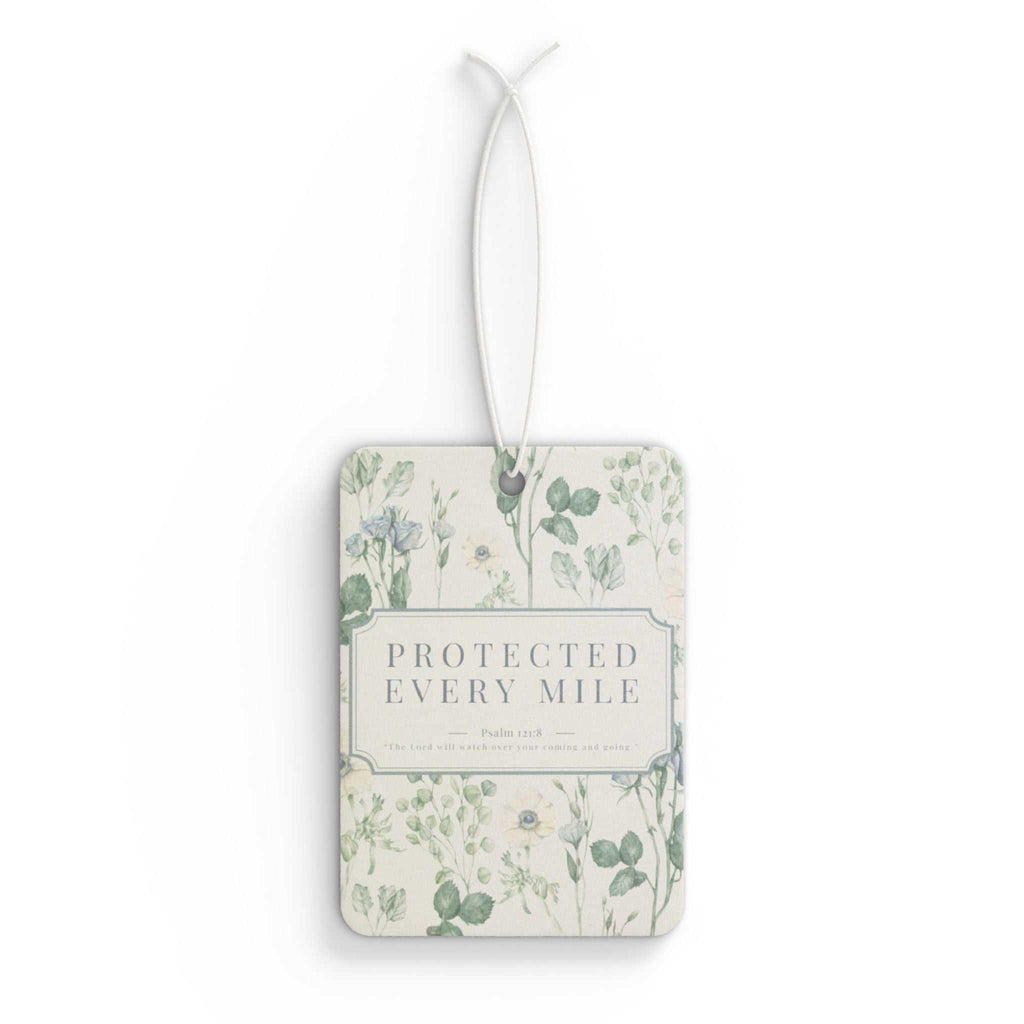 Protected Every Mile car air freshener with floral design