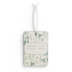 Protected Every Mile car air freshener with floral design