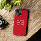 Red durable phone case with "God is always on time" text, dual-layer protection and matte finish