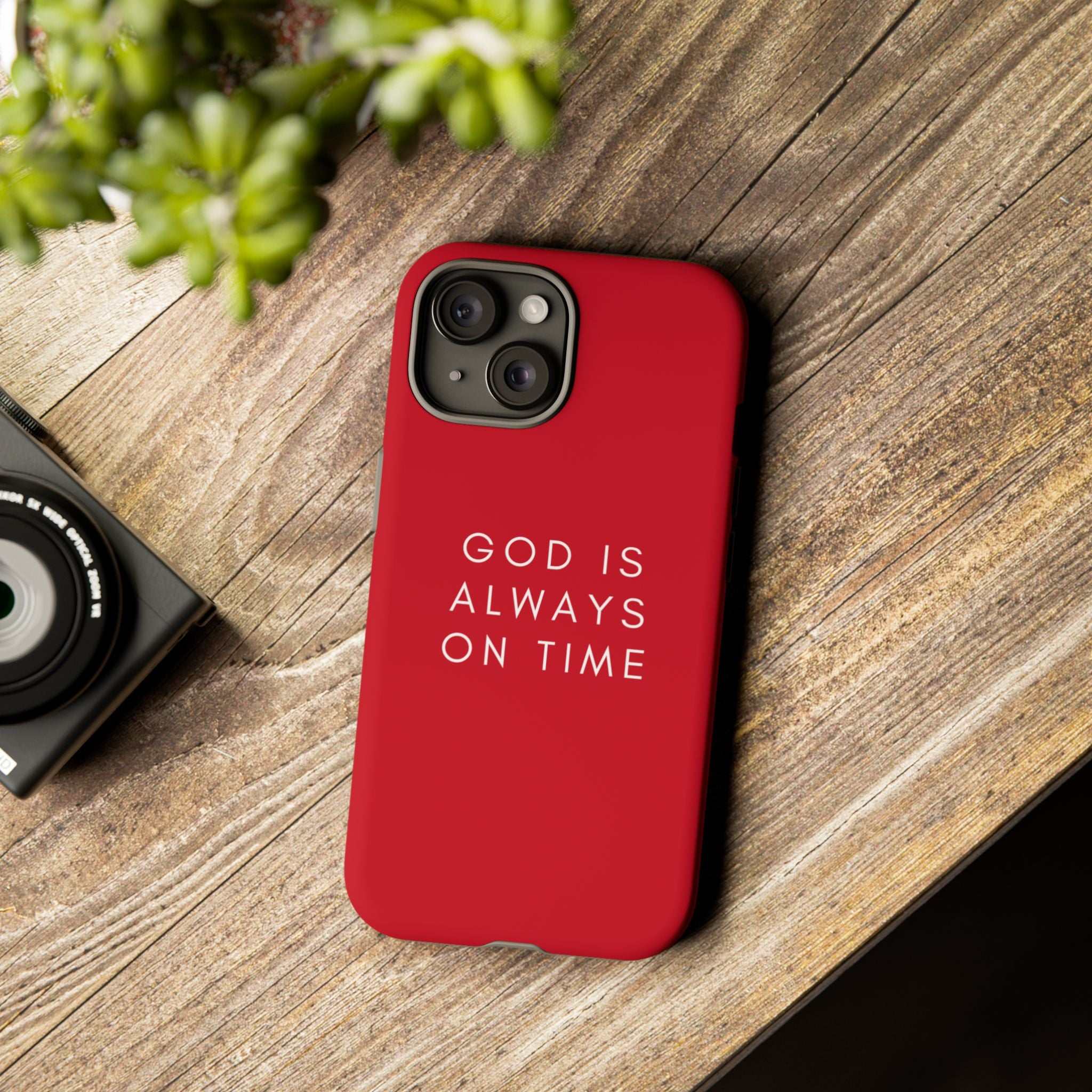 Red durable phone case with "God is always on time" text, dual-layer protection and matte finish