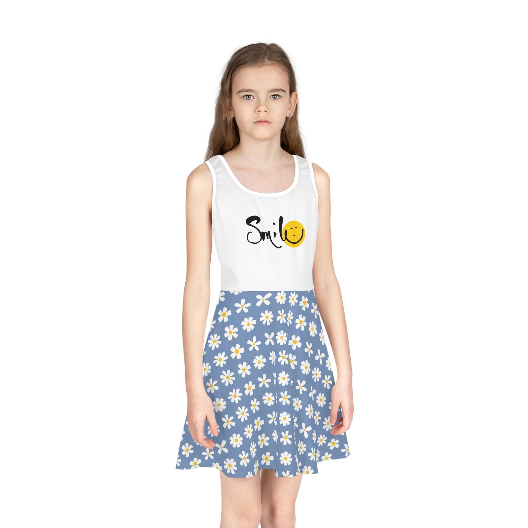 Girl wearing a mid-length sleeveless sundress with a white top featuring "Smile" and a smiley face, and a blue A-line skirt with white daisies.