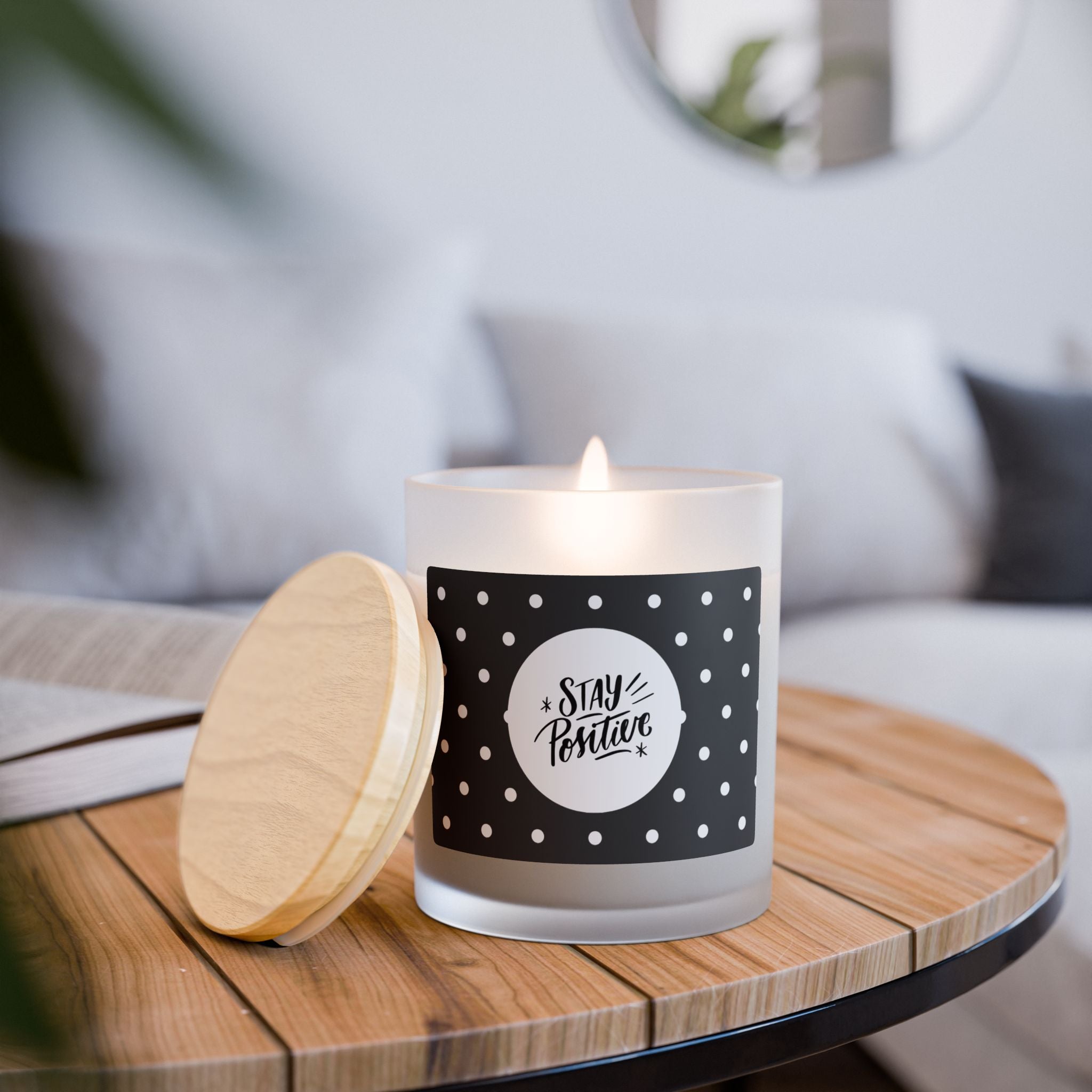 Stay Positive glass candle with wooden wick in frosted vessel and maple lid on wooden surface