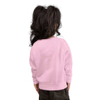 Toddler wearing a cozy pink sweatshirt