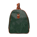 Tropical travel bag with green leaf print, brown PU leather handles