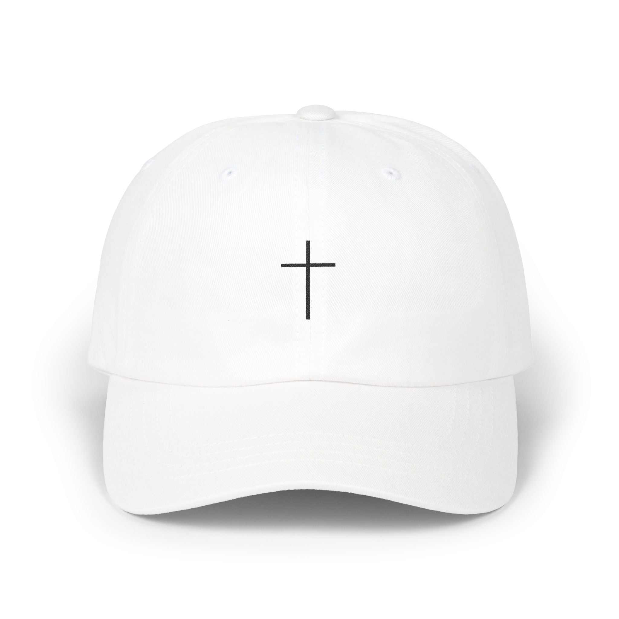 White hat with black embroidered Christian cross on front