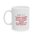 White ceramic mug with Psalm 119:105 scripture "Your word is a lamp to my feet and a light to my path" in red and blue text, 11oz size.