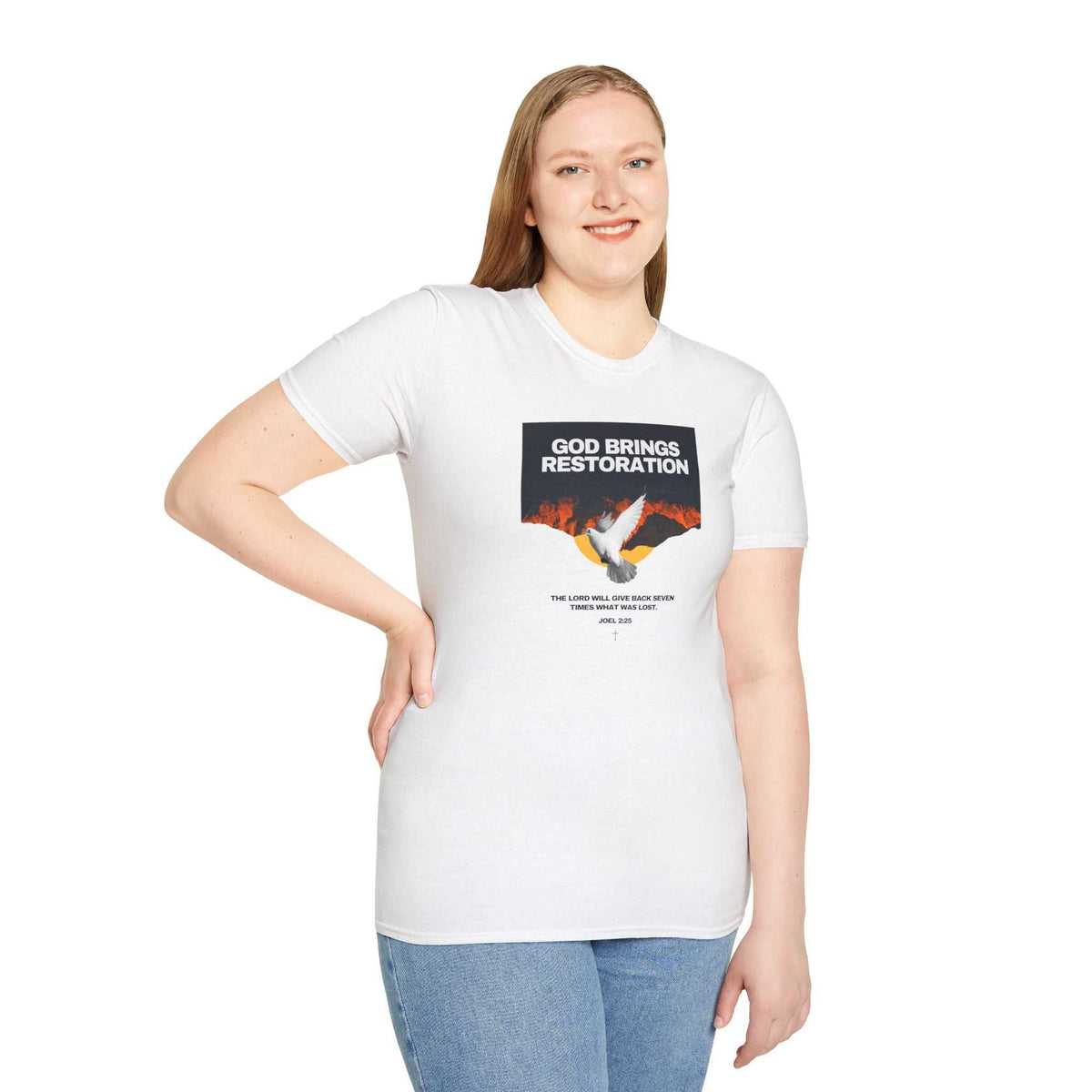 Woman wearing a white Restored by Grace faith statement T-shirt with a dove and "God Brings Restoration" text