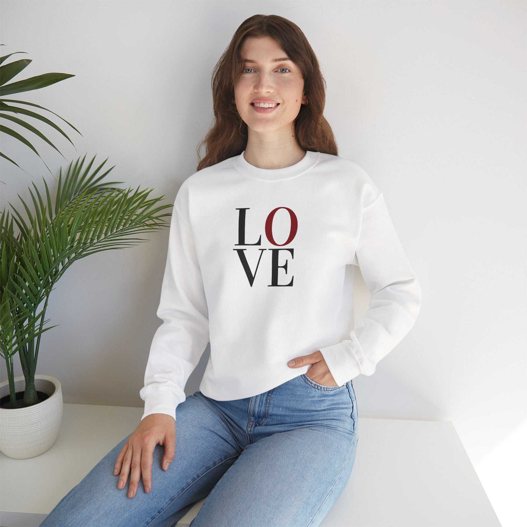 Woman wearing a white heavy blend Love Sweatshirt