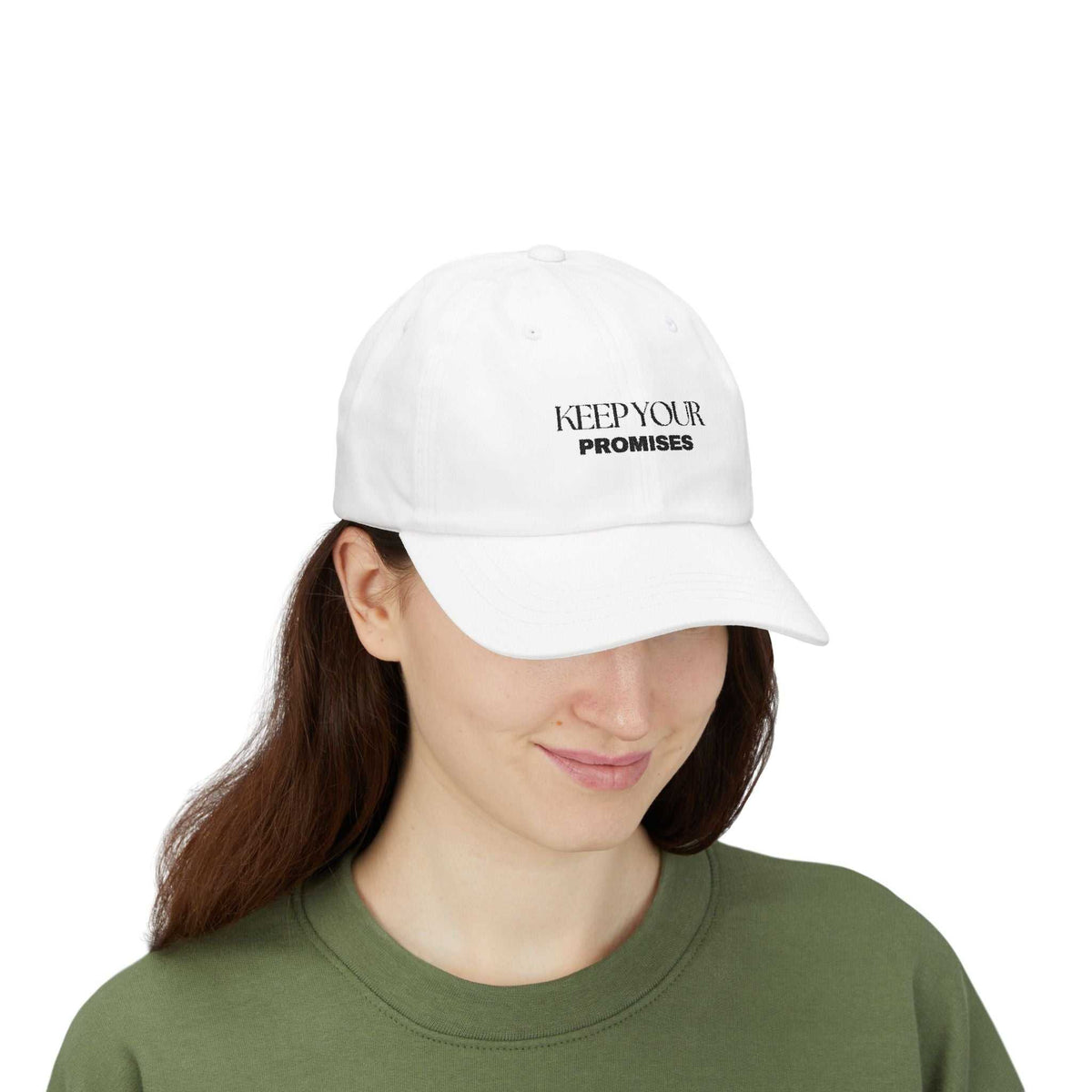 Woman wearing white cap with "KEEP YOUR PROMISES" text